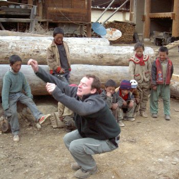 Playing hopscotch with local children near the Tibetan border